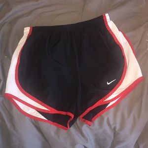 Red Nike shorts